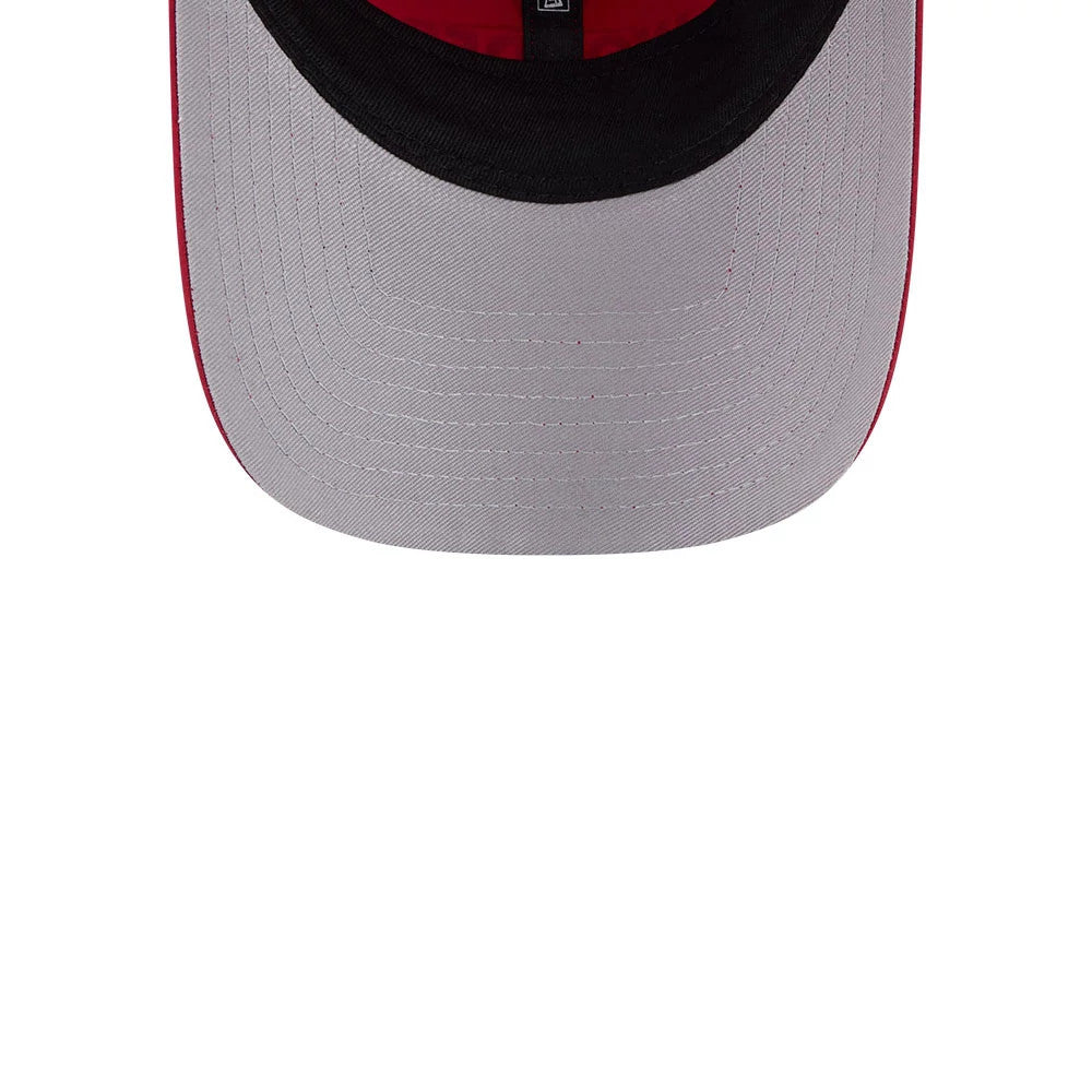 New Era Womens DC Wonder Woman Dark Red Open Back Cap, inside view showing the light grey undervisor, black sweatband with a small size tag at the centre, and grey stitching lines around the visor edge, highlighting durability and design.