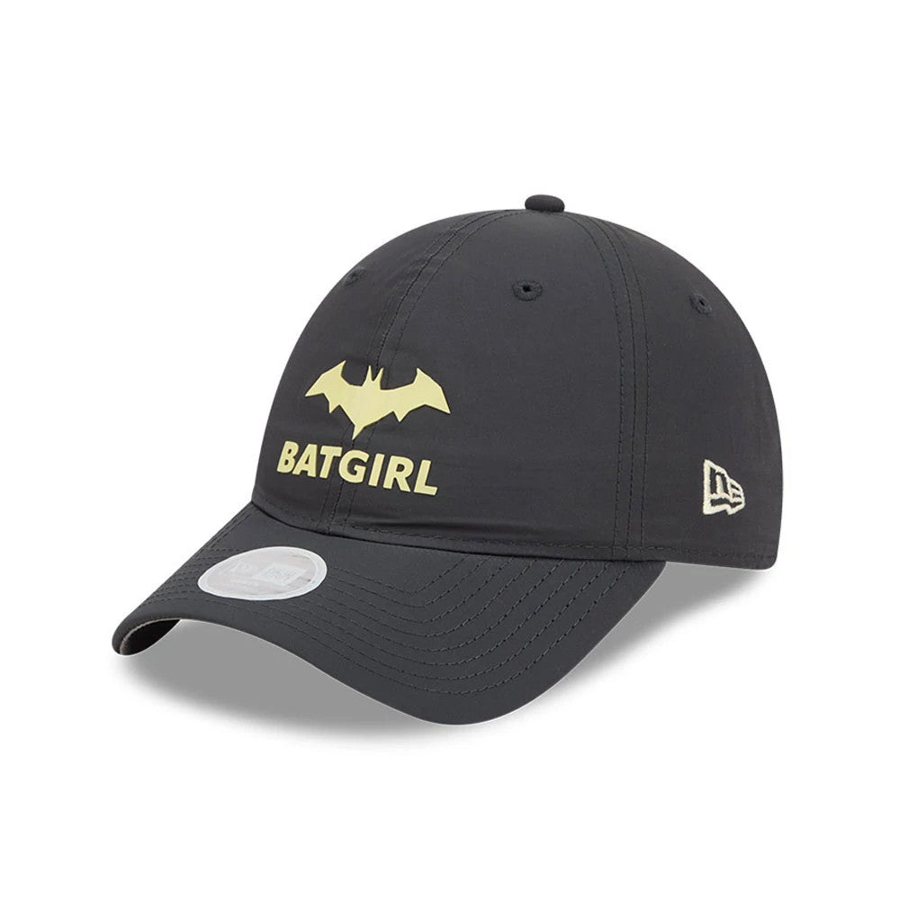 New Era Womens DC Batgirl Charcoal Open Back Cap, three-quarter view showing a yellow Batgirl logo and text on the front panel, a New Era flag logo on the left side, and an attached 9FORTY size sticker on the charcoal curved visor.