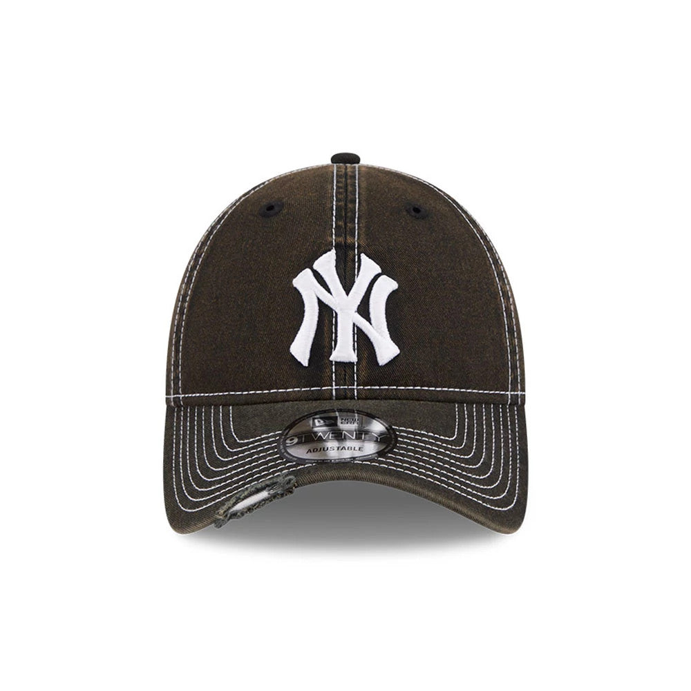 New York Yankees MLB Stencil Distressed Black New Era 9TWENTY Adjustable Cap, front view showing the white embroidered NY logo on the distressed black crown, featuring contrast white stitching and a 9TWENTY size sticker on the curved visor.