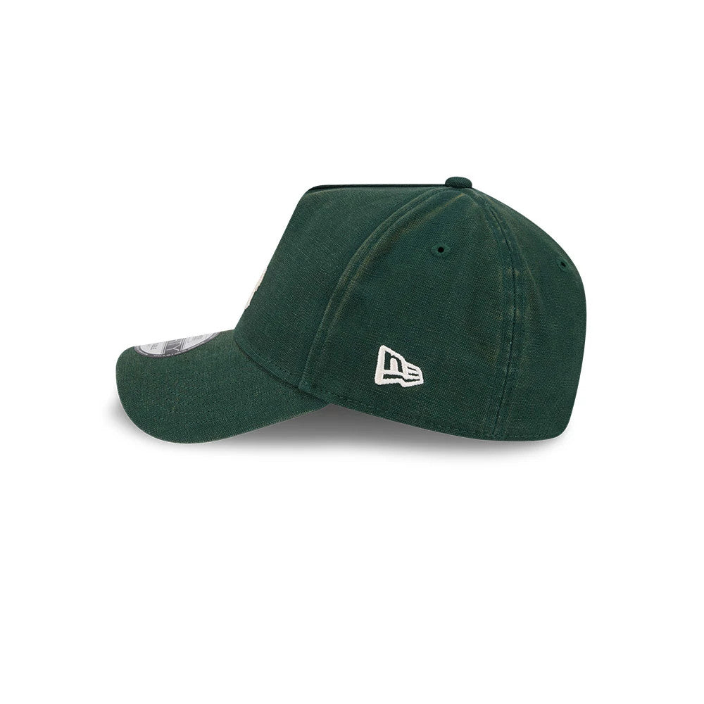 LA Dodgers MLB Washed Canvas Dark Green New Era 9FORTY A-Frame Adjustable Cap, side view showing the white New Era flag logo on the left side of the deep dark green crown, with a curved visor and embroidered eyelets.