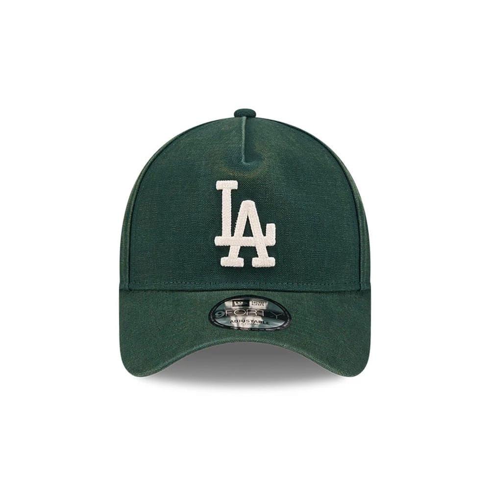 LA Dodgers MLB Washed Canvas Dark Green New Era 9FORTY A-Frame Adjustable Cap, front view showing the white raised embroidered LA logo on the structured dark green crown, with a curved visor and a 9FORTY size sticker centred on the visor.