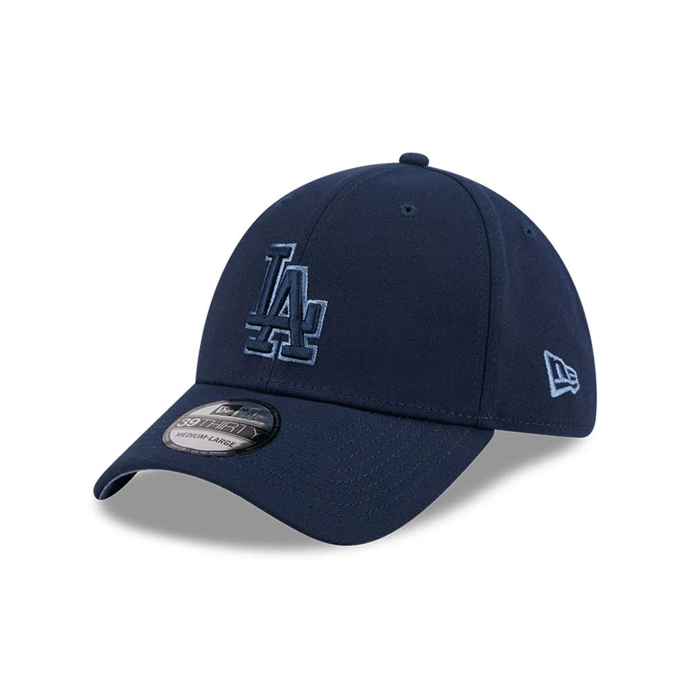 LA Dodgers MLB Faded Oceanside Dark Blue New Era 39THIRTY Stretch Fit Cap, three-quarter view showing the raised dark blue LA logo embroidered on the front panel, with a curved visor featuring a 39THIRTY size sticker.