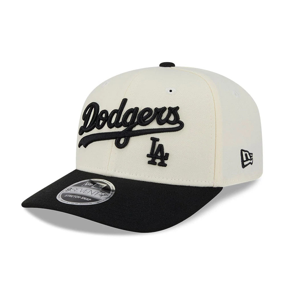 LA Dodgers MLB 2 Tone Cream & Black New Era 9SEVENTY Stretch Snap Adjustable Cap, three-quarter view showing the raised black embroidered Dodgers script on the front panel, matched with a black visor and New Era flag logo on the left side.