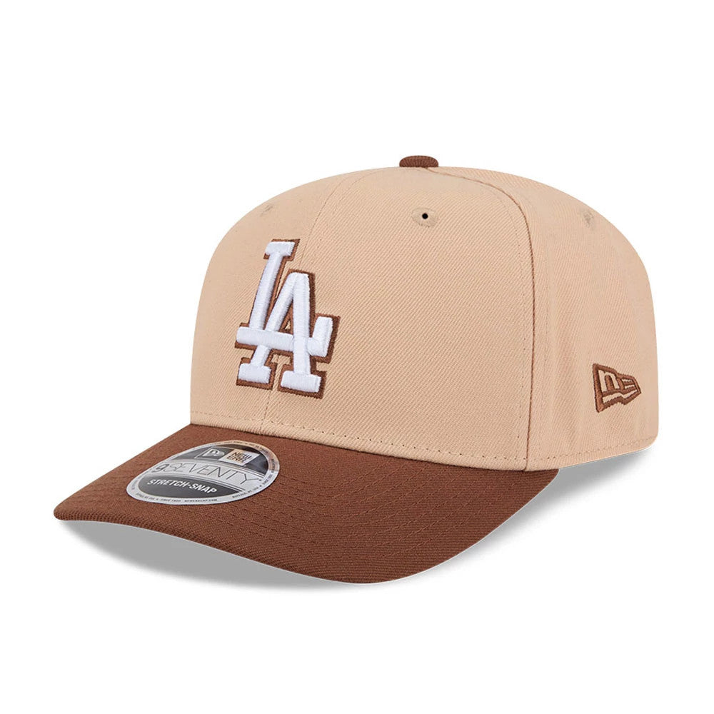 LA Dodgers MLB Candied Pecan Beige New Era 9SEVENTY Stretch Snap Adjustable Cap, front view showing the raised white LA logo outlined in brown embroidery on the beige crown, brown curved visor with a 9SEVENTY size sticker.