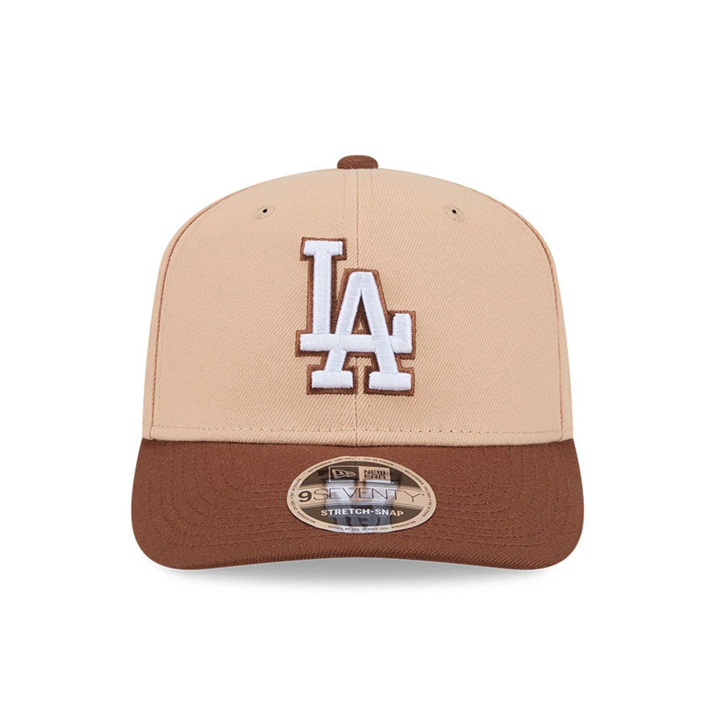 LA Dodgers MLB Candied Pecan Beige New Era 9SEVENTY Stretch Snap Adjustable Cap, front view showing the raised white LA logo with brown outlining on the beige crown, a contrasting brown visor, and the 9SEVENTY size sticker on the visor.