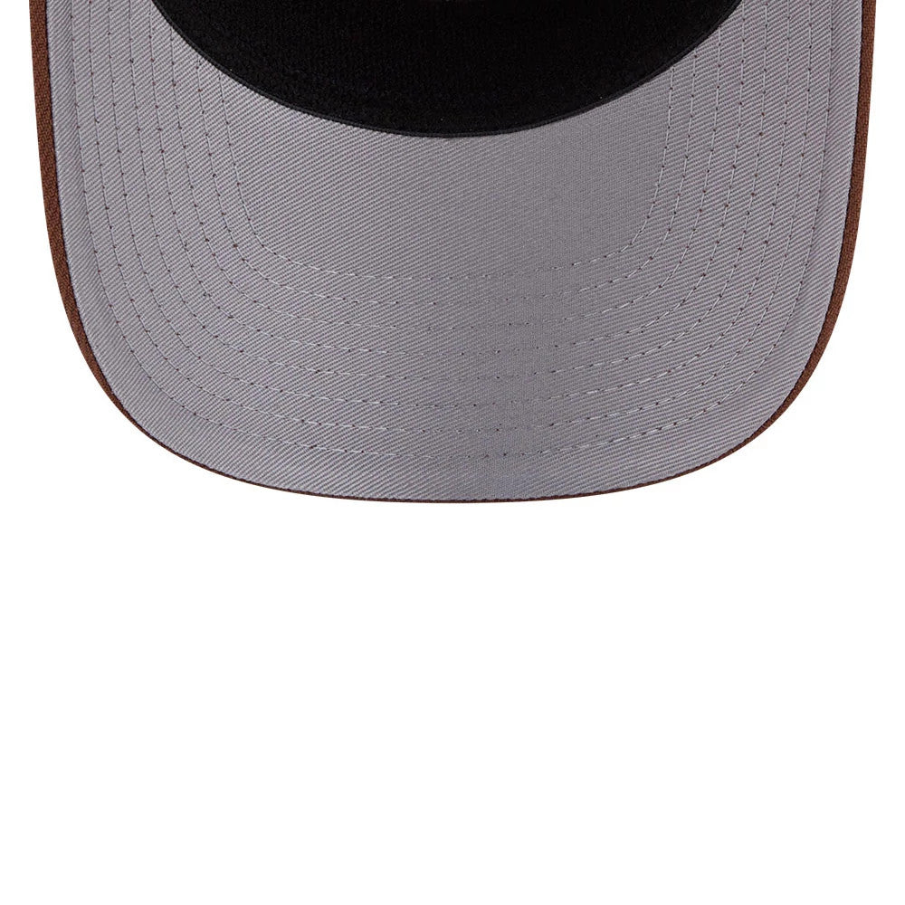 LA Dodgers MLB Candied Pecan Beige New Era 9SEVENTY Stretch Snap Adjustable Cap, underside view showing the grey undervisor with beige stitching and the contrasting dark crown lining, highlighting the detailed craftsmanship typical of New Era caps.