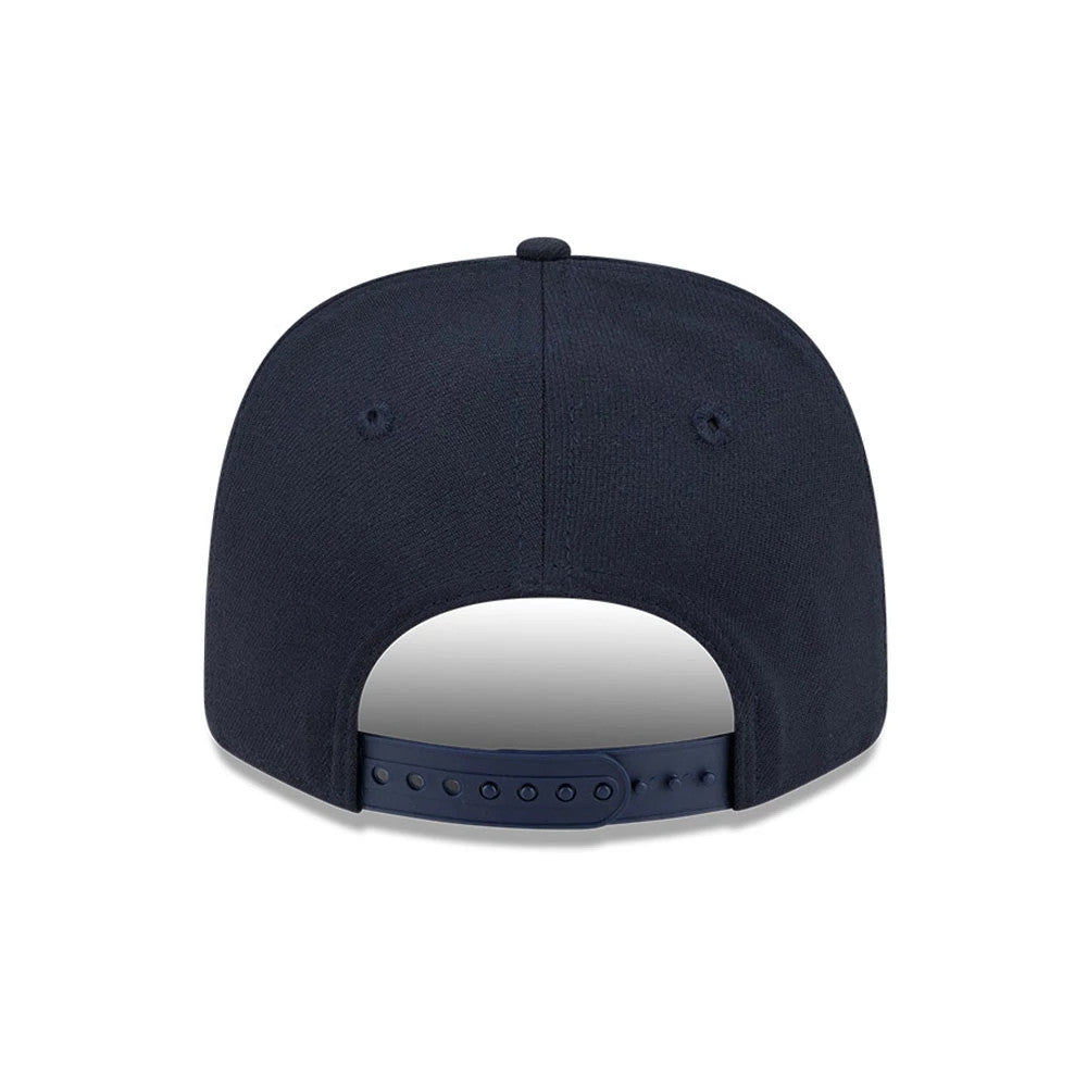 New York Yankees MLB Navy New Era 9SEVENTY Stretch Snap Adjustable Cap, rear view showing a navy crown with matching embroidered eyelets and a top button, the navy plastic snap closure along the back edge.