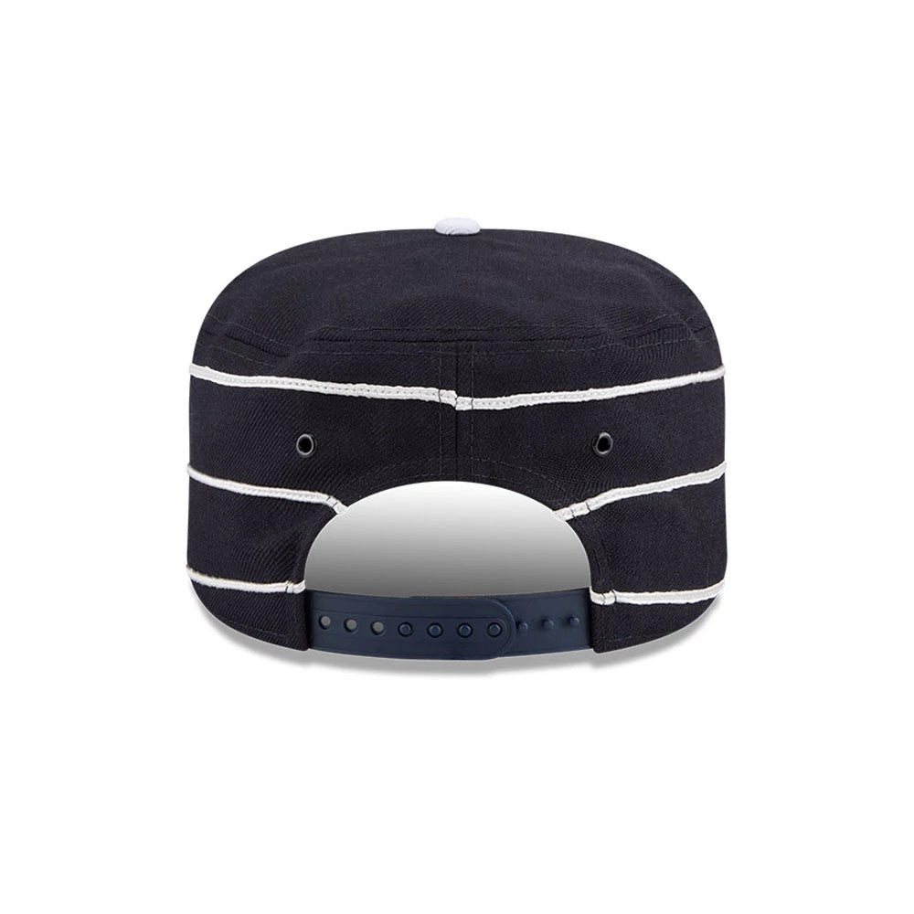 New Era New York Yankees MLB Cooperstown Navy Pillbox Adjustable Cap, rear view showing the navy snap closure offering adjustable comfort, with white horizontal stripes on the structured navy panels and the top button in contrast white.