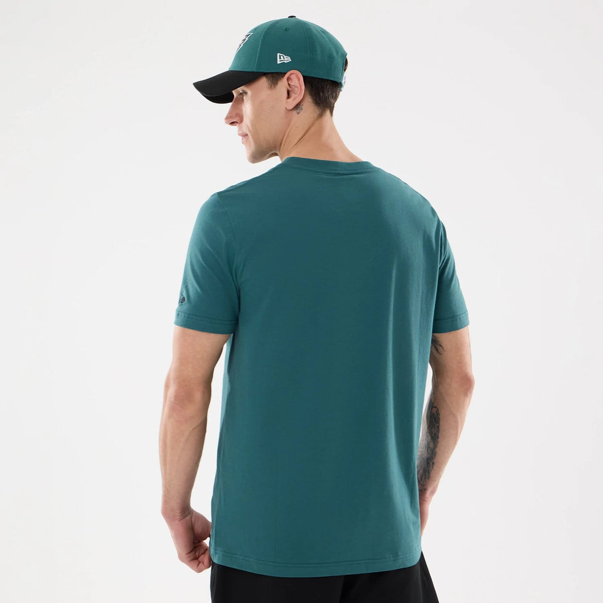 The model is wearing this NFL Training 2026 Philadelphia Eagles T-Shirt in dark green. 2