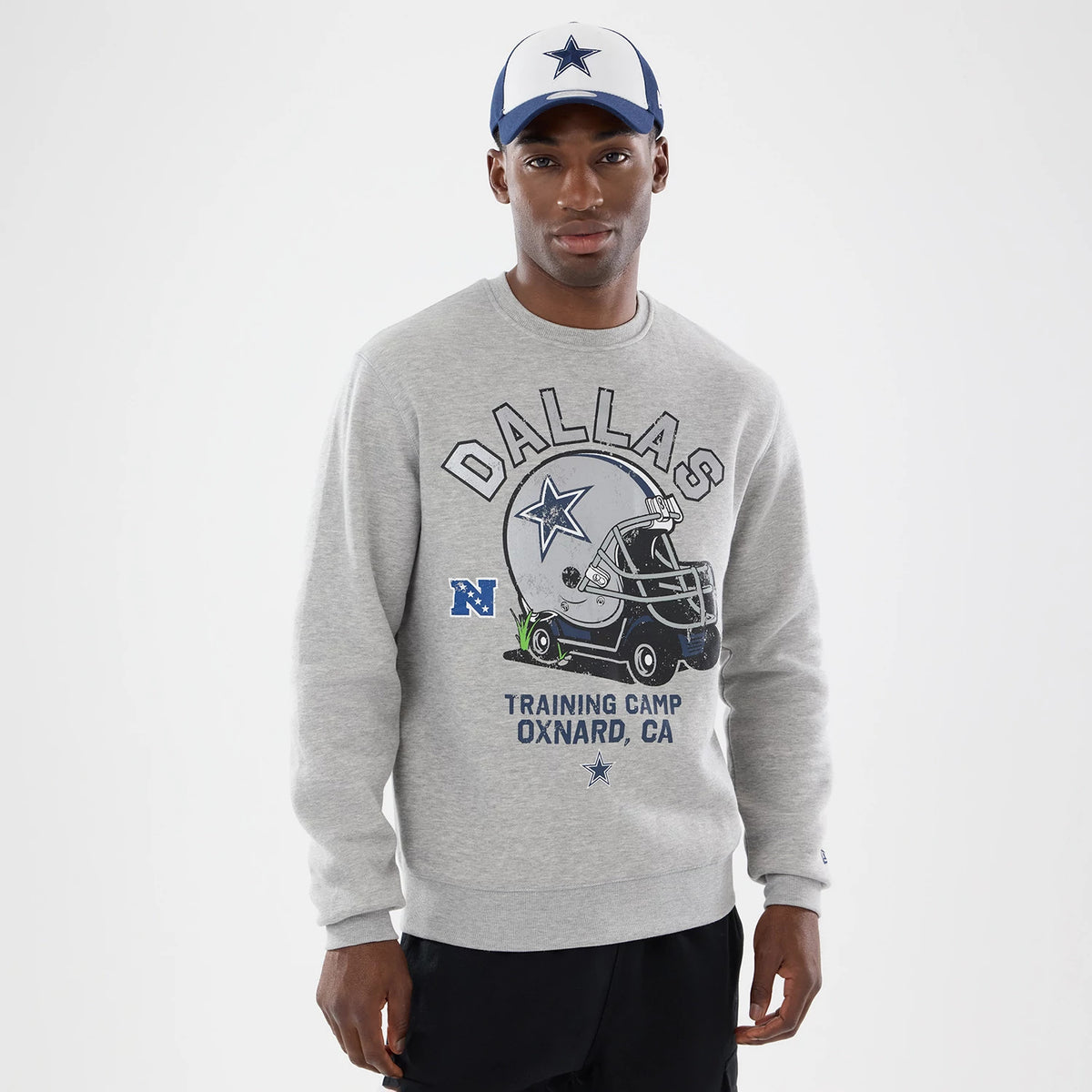 The model is wearing this NFL Training 2026 Dallas Cowboys Crew Neck Sweater in grey. 1