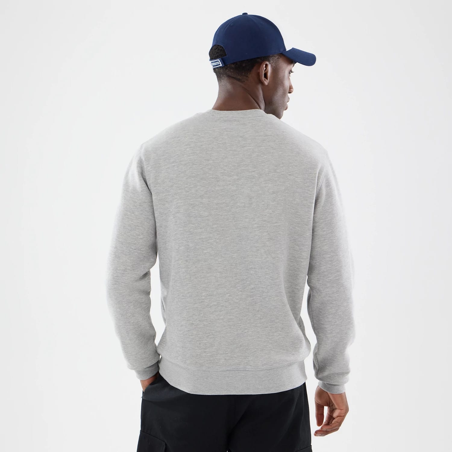 The model is wearing this NFL Training 2026 Dallas Cowboys Crew Neck Sweater in grey. 2