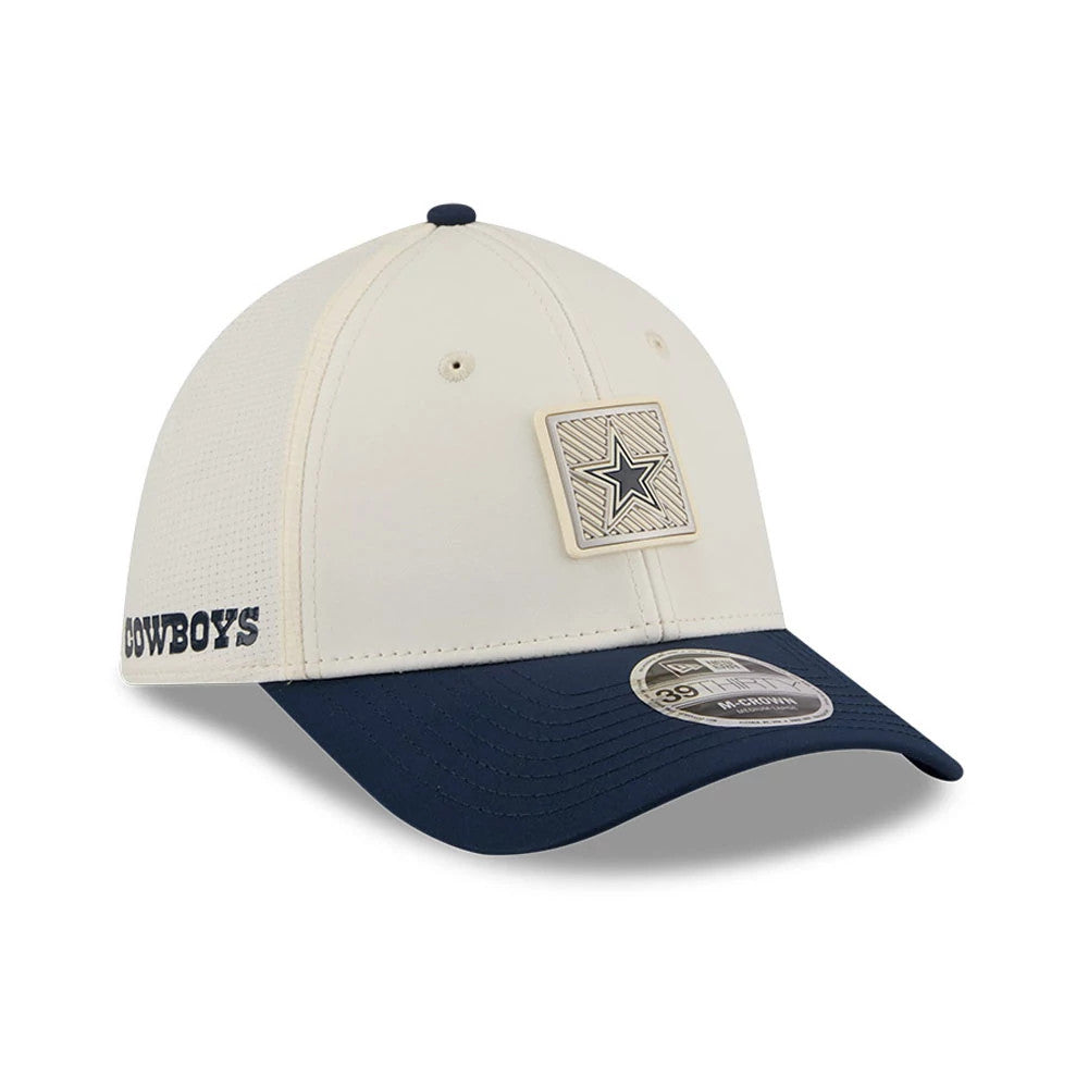Dallas Cowboys NFL Training 2026 White New Era 39THIRTY M-Crown Stretch Fit Cap, three-quarter view showing an embroidered blue star patch on the front panel, navy curved visor with 39THIRTY size sticker, and Cowboys lettering on the left side.