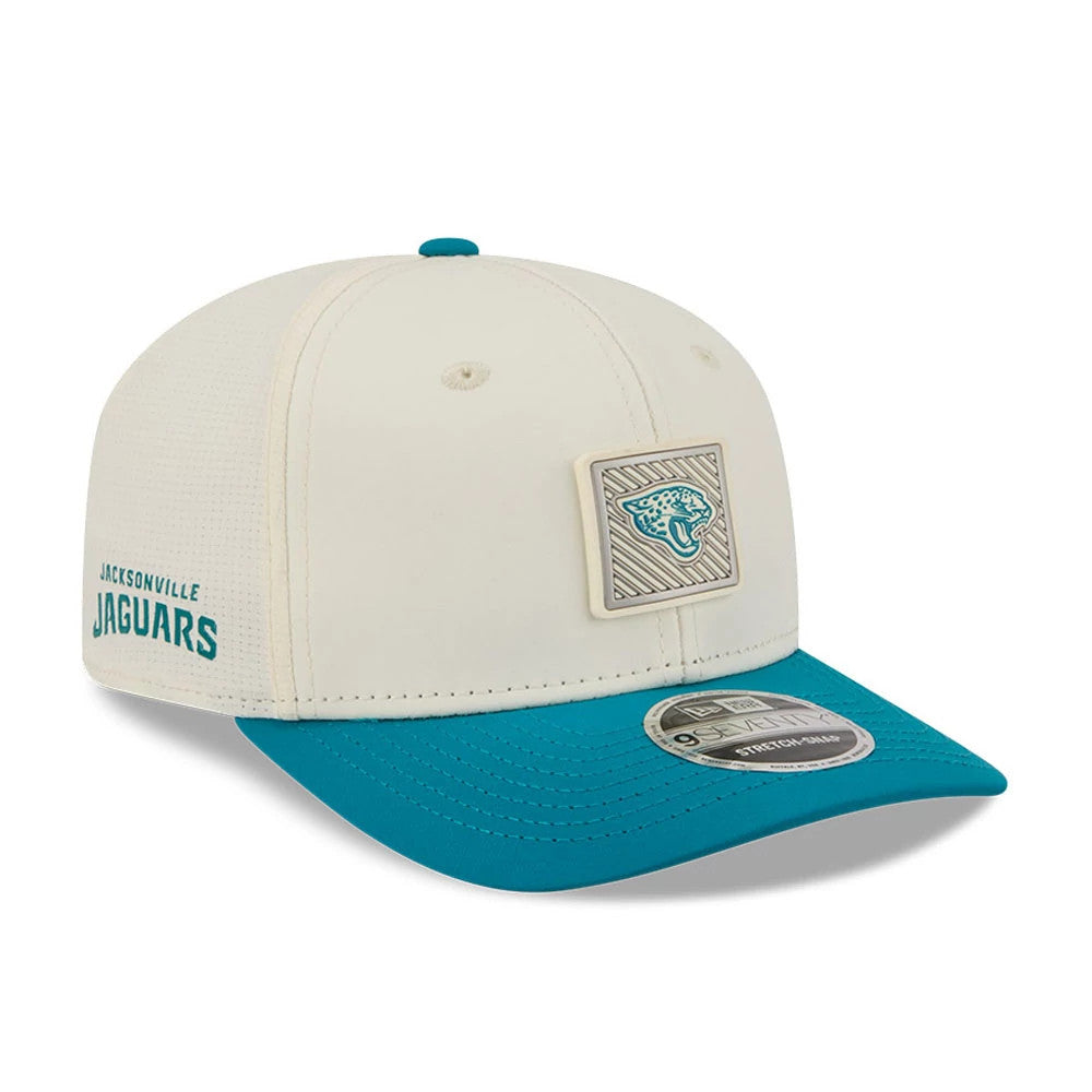 Jaguars NFL Training 2026 White New Era 9SEVENTY Stretch Snap Adjustable Cap, three-quarter view showing a raised team logo patch on the front panel, teal embroidered Jaguars wordmark on the side, and teal curved visor with a 9SEVENTY size sticker.