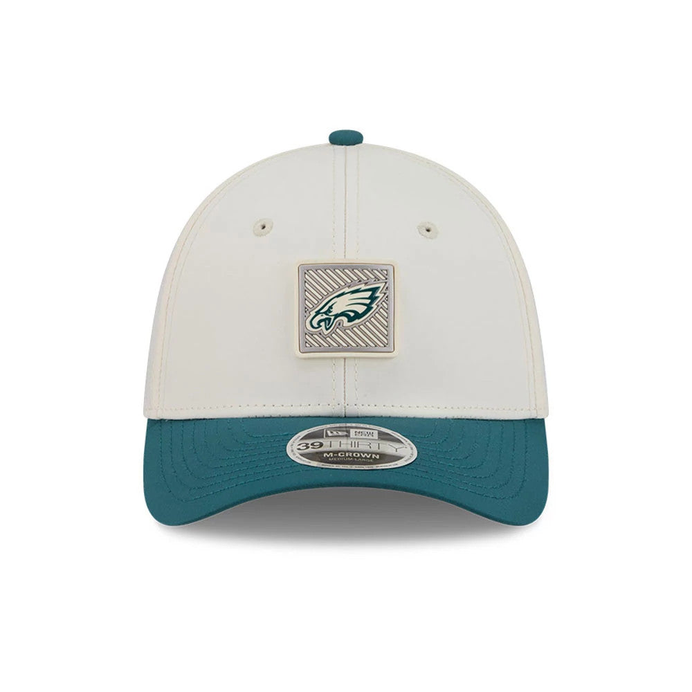 Eagles NFL Training 2026 White New Era 39THIRTY M-Crown Stretch Fit Cap, front view showing the Eagles logo in a square embroidered patch in green and white on the front panels, with a contrasting teal visor and a 39THIRTY size sticker.