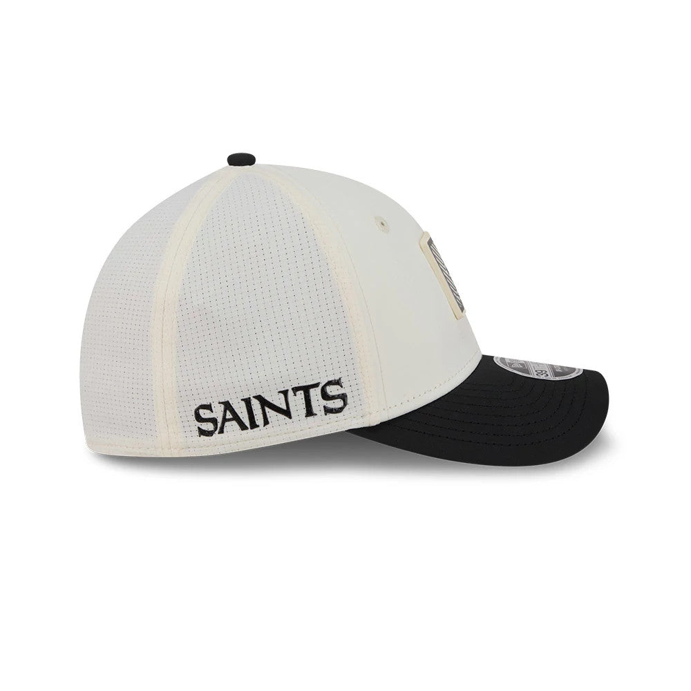 New Orleans Saints NFL Training 2026 White New Era 39THIRTY M-Crown Stretch Fit Cap, side view showing the black embroidered SAINTS lettering on the white back panel, a black curved visor and a 39THIRTY size sticker on the top.