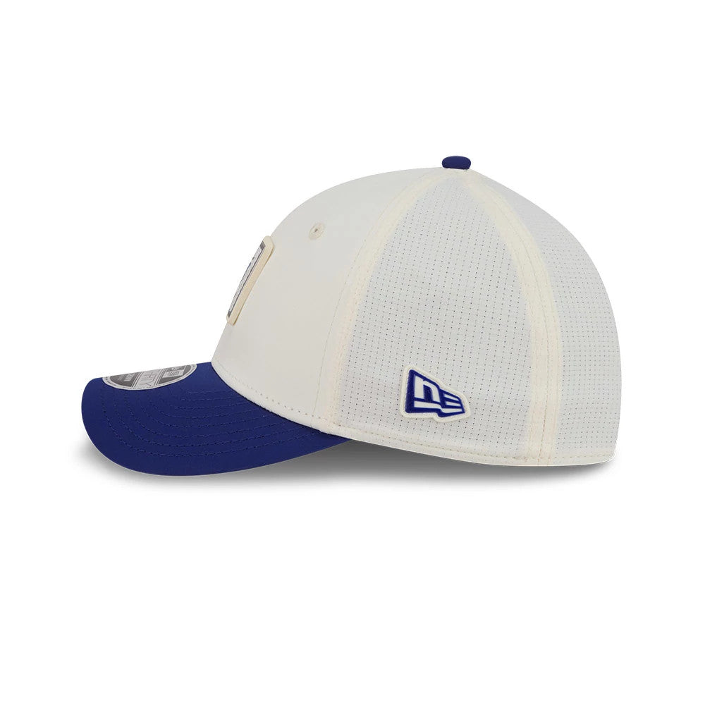 Official Logo NFL Training 2026 White New Era 39THIRTY M-Crown Stretch Fit Cap, side view showing the blue embroidered New Era flag logo on the left, white mesh crown, and contrasting blue curved visor with a 39THIRTY size sticker.