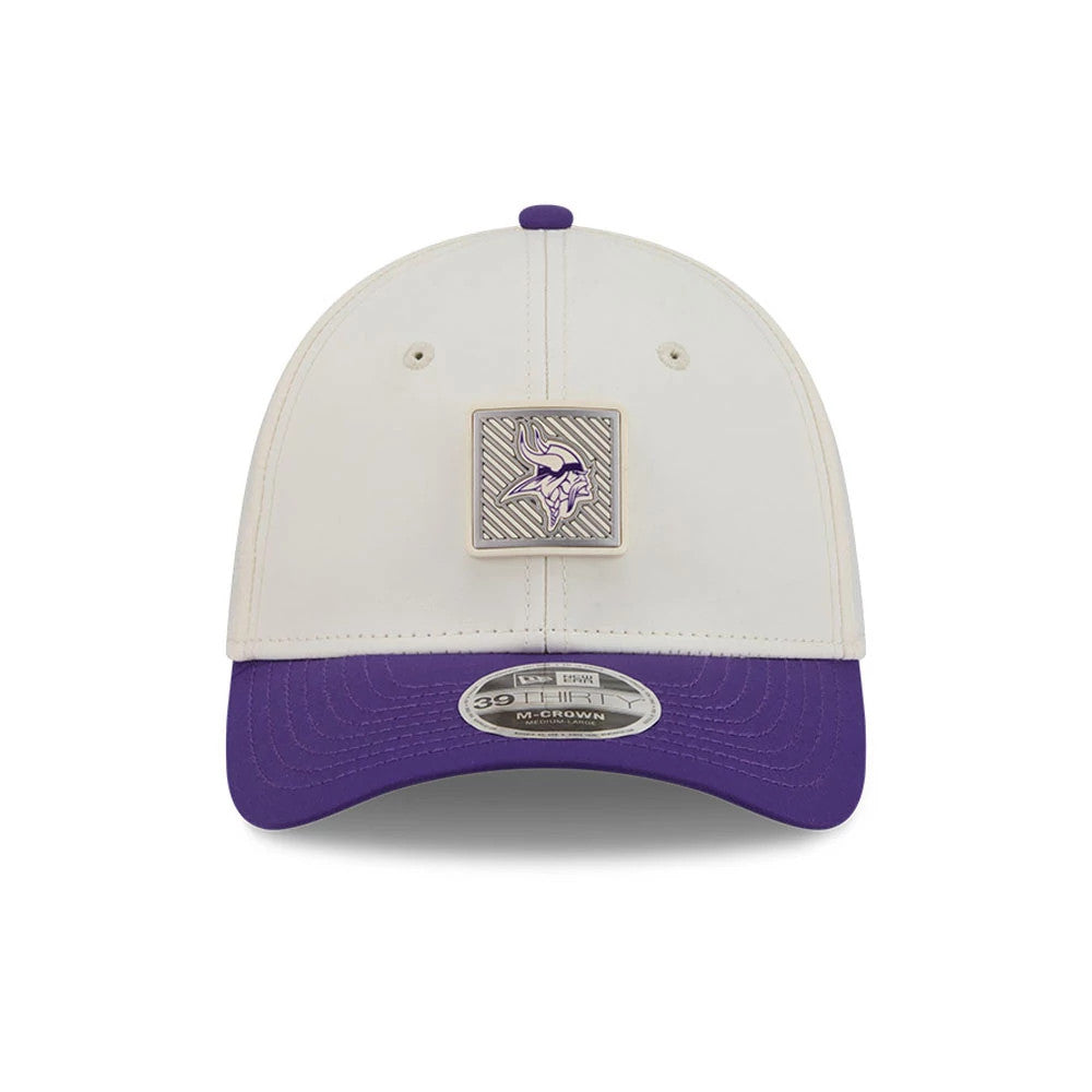 Minnesota Vikings NFL Training 2026 White New Era 39THIRTY M-Crown Stretch Fit Cap, front view showing a square purple Vikings logo emblem on the front panel, a purple curved visor, and a 39THIRTY size sticker on the visor.