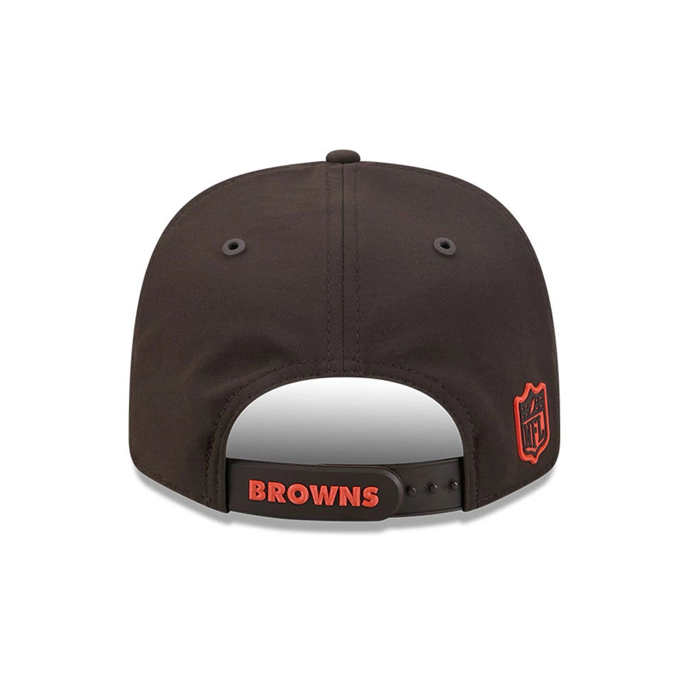 Browns NFL Sideline 2026 Dark Brown New Era 9SEVENTY Stretch Snap Adjustable Cap, rear view showing an orange NFL shield logo on the right panel, with BROWNS text across the snapback closure above the curved edge.
