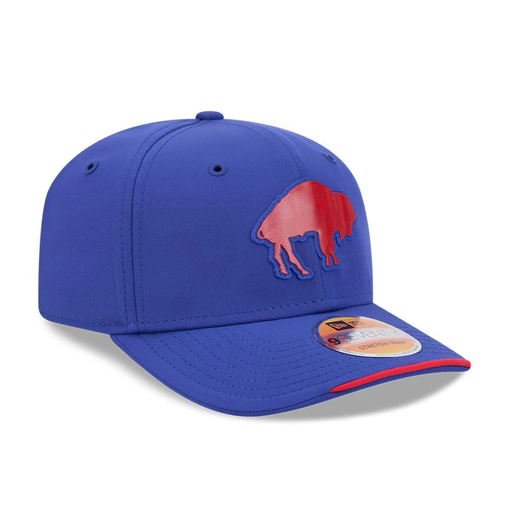 Buffalo Bills NFL Sideline 2026 Blue New Era 9SEVENTY Stretch Snap Adjustable Cap, three-quarter view showing the raised red Buffalo logo on the blue front panel, blue curved visor with a red edge, and the 9SEVENTY size sticker.