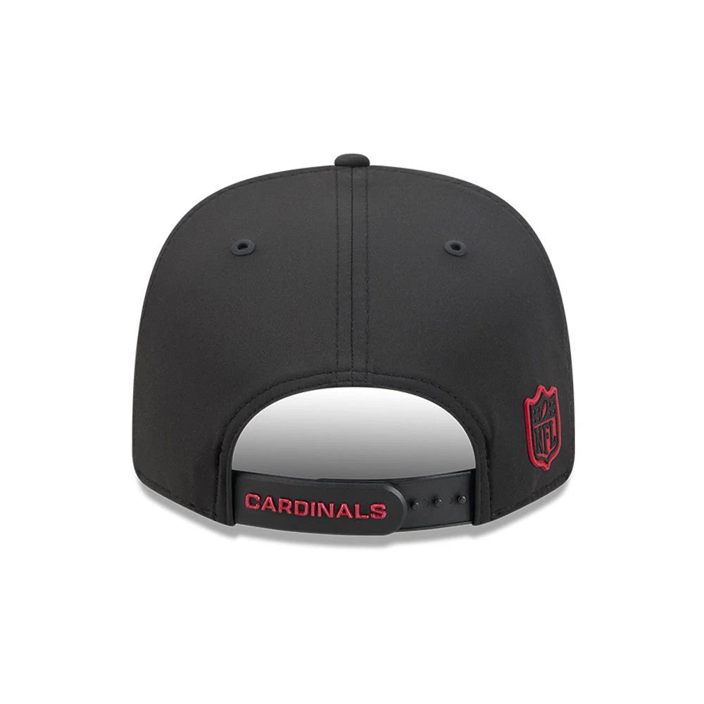 Cardinals NFL Sideline 2026 Black New Era 9SEVENTY Stretch Snap Adjustable Cap, rear view showing an embroidered red NFL shield logo on the back panel, the word CARDINALS in red on the black adjustable strap, and eyelets.