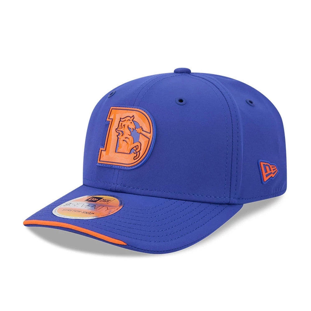 Broncos NFL Sideline 2026 Blue New Era 9SEVENTY Stretch Snap Adjustable Cap, three-quarter view showing the orange embroidered Broncos logo on the front panel, a matching orange New Era flag logo on the left side.