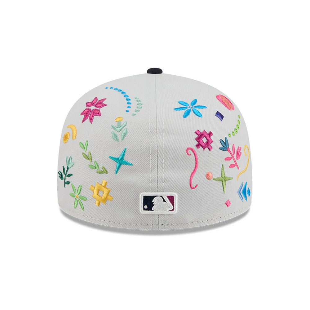 New York Yankees MLB Heritage Light Beige New Era 59FIFTY Fitted Cap, rear view showing embroidered floral and geometric patterns across the back panels in various colours, with the MLB Batterman logo at the centre back.