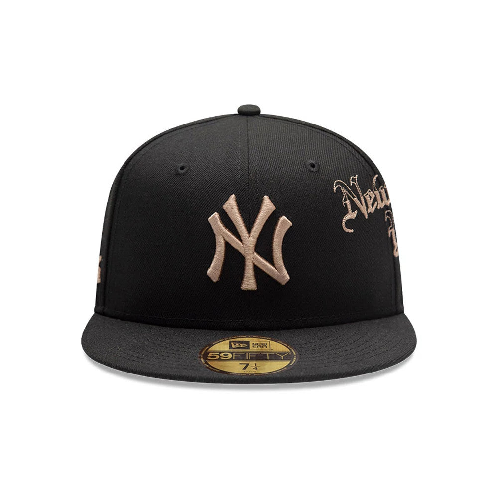 New York Yankees MLB Heritage Black New Era 59FIFTY Fitted Cap, front view showing the raised gold NY logo centrally embroidered on the black panel, the gold and black 59FIFTY size sticker on the flat visor, and gold script detail on the side.
