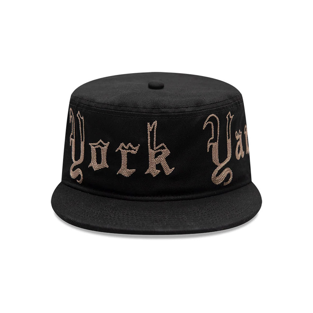 New Era New York Yankees MLB Heritage Black Pillbox Cap, front view showing gold embroidery of York and Yankees on the structured black crown, with a flat black visor and a small top button.
