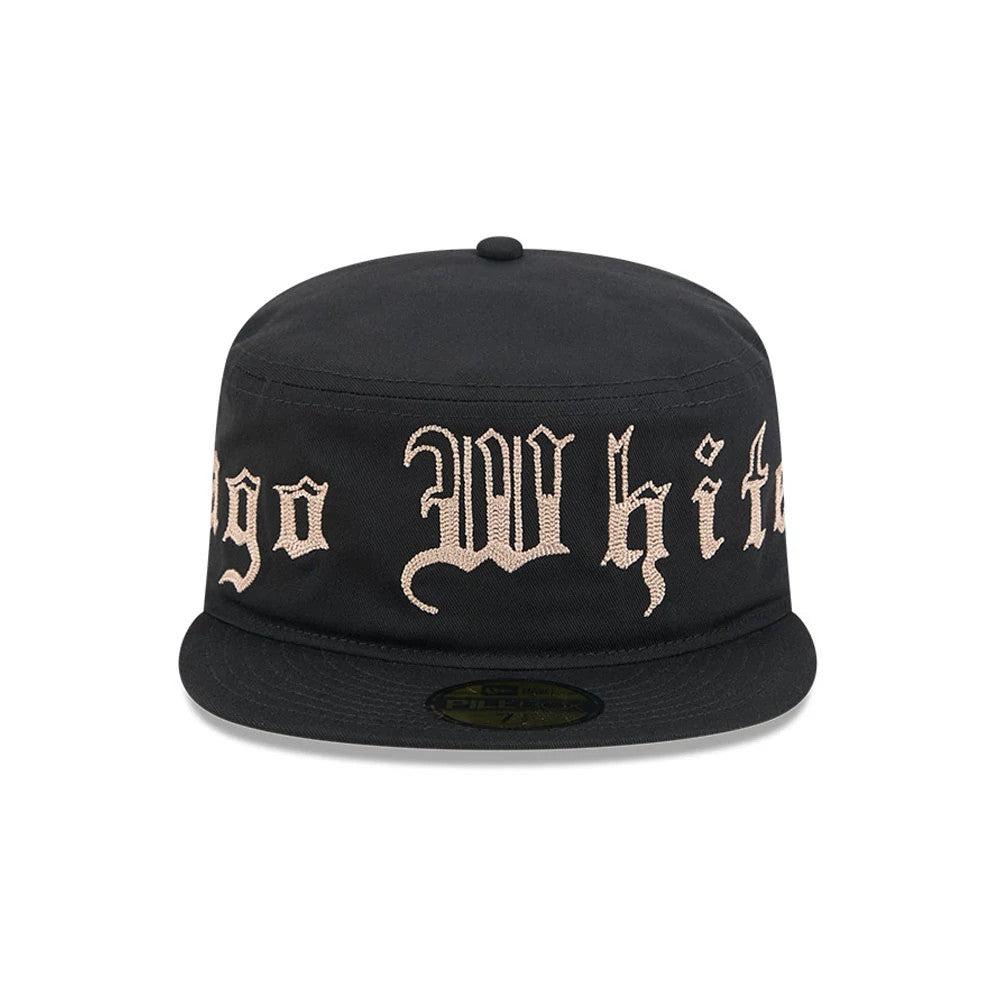 New Era Chicago White Sox MLB Heritage Black Pillbox Cap, front view showing beige embroidered Chicago White Sox text across the crown, a black flat visor, and a dark gold size sticker on the underside of the visor.