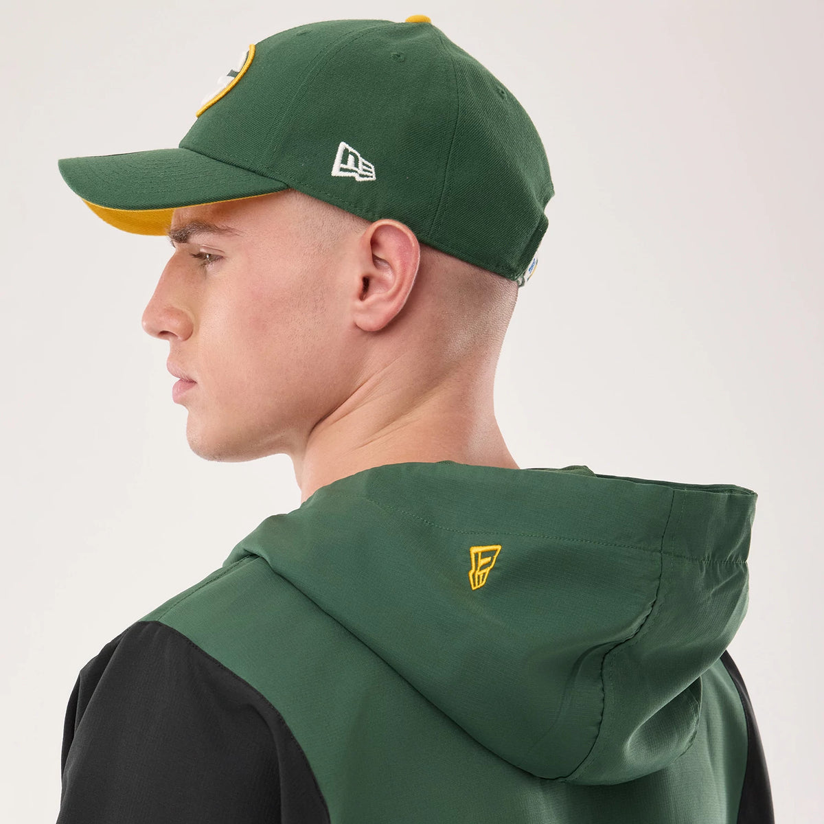 The model is wearing this NFL Green Bay Packers Jacket in dark green. 7