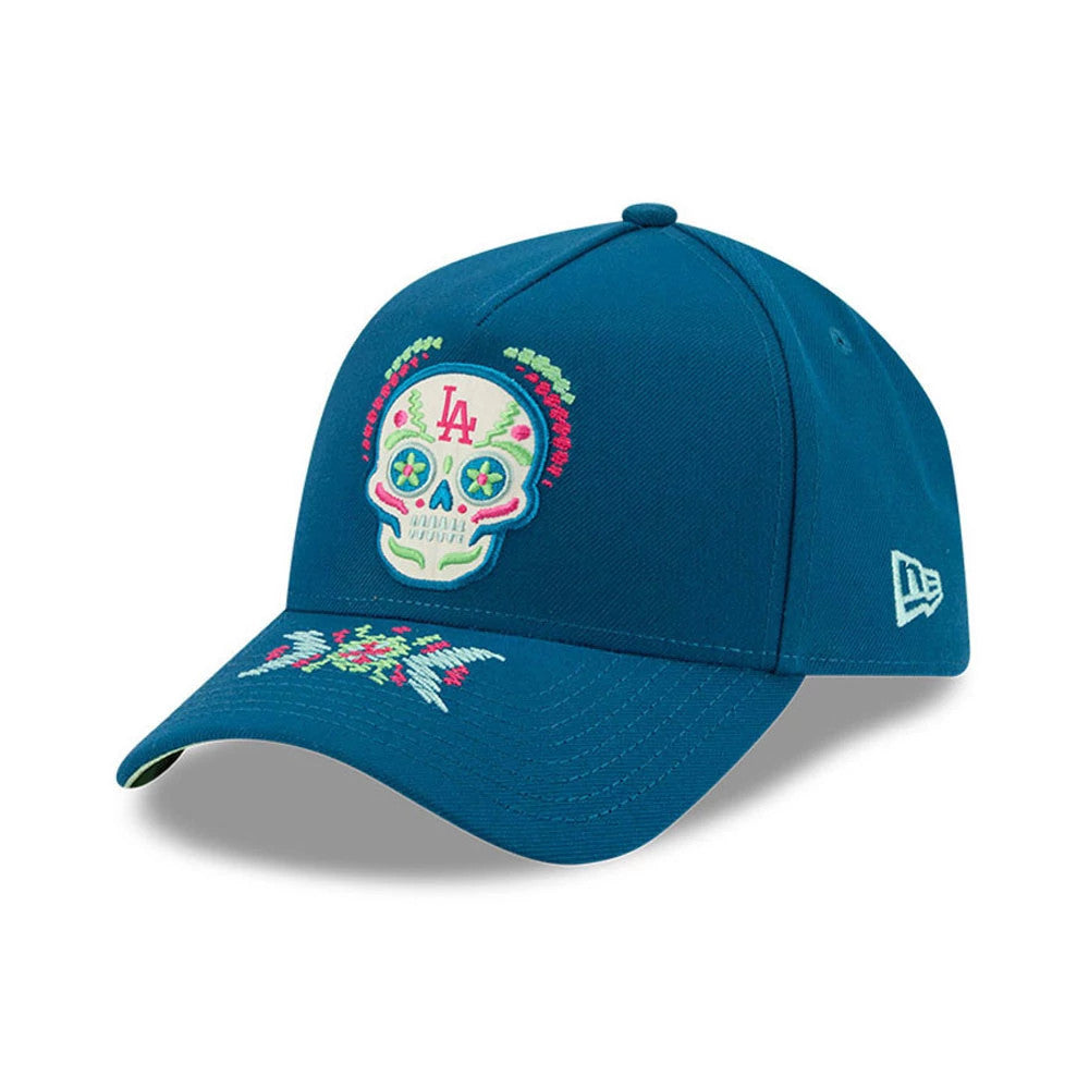 LA Dodgers MLB Day Of The Dead Blue New Era 9FORTY A-Frame Adjustable Cap, front view showing the colourful embroidered sugar skull logo on the structured blue crown, floral embroidery on the curved visor, and New Era flag logo on the left side.