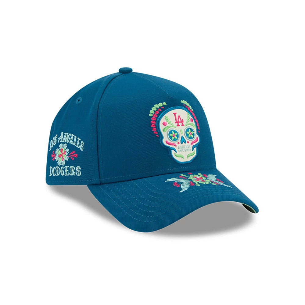 LA Dodgers MLB Day Of The Dead Blue New Era 9FORTY A-Frame Adjustable Cap, three-quarter view showing the colourful embroidered skull with LA initials on the front panel, floral embroidery on the visor and Los Angeles Dodgers text on the left side.