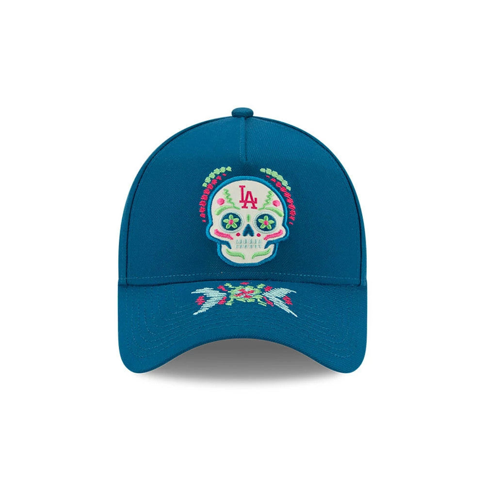 LA Dodgers MLB Day Of The Dead Blue New Era 9FORTY A-Frame Adjustable Cap, front view showing a colourful embroidered sugar skull with floral patterns on the front panel, and matching embroidery designs on the blue curved visor.