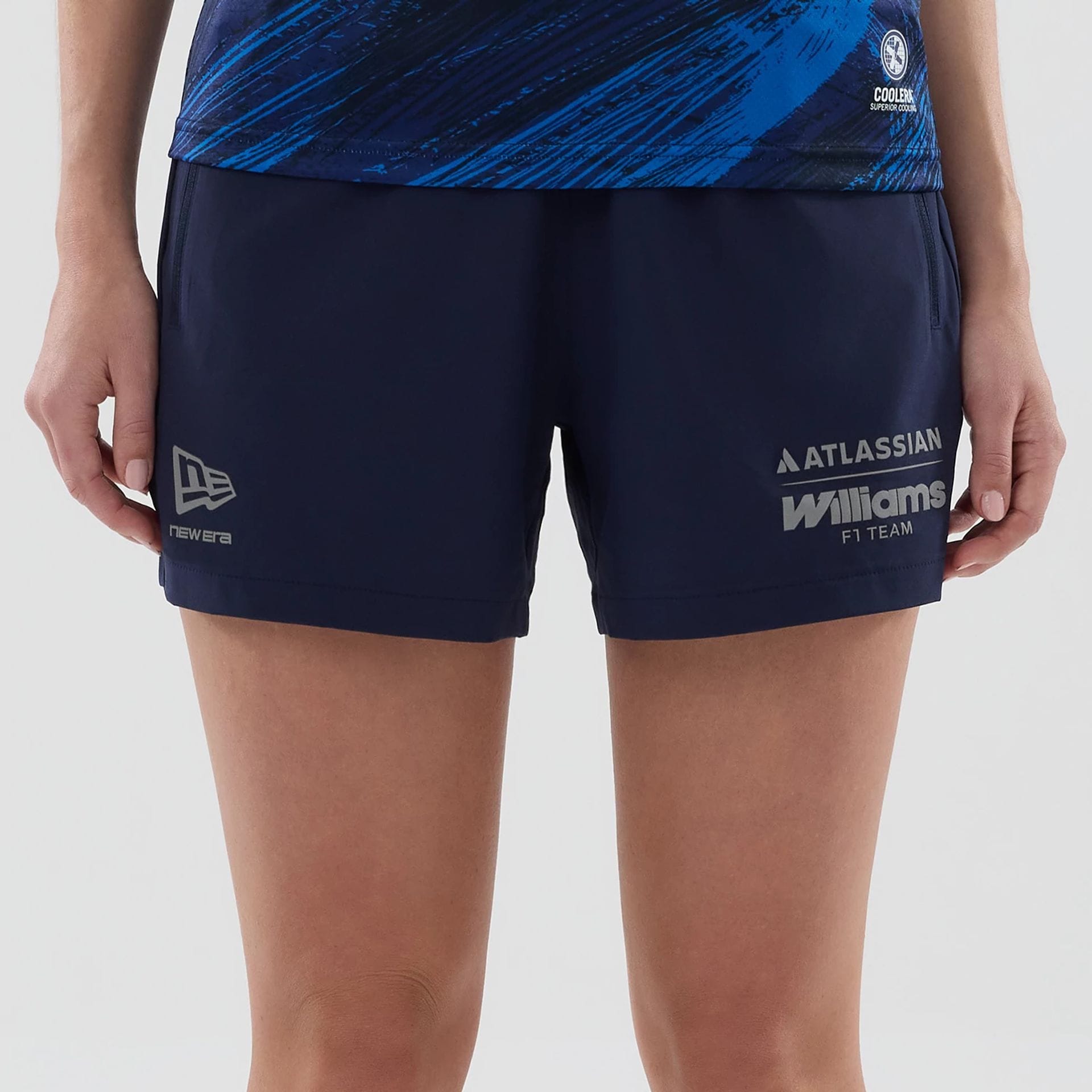 The model is wearing these Womens Atlassian Williams F1 Team Training Shorts in navy. 2