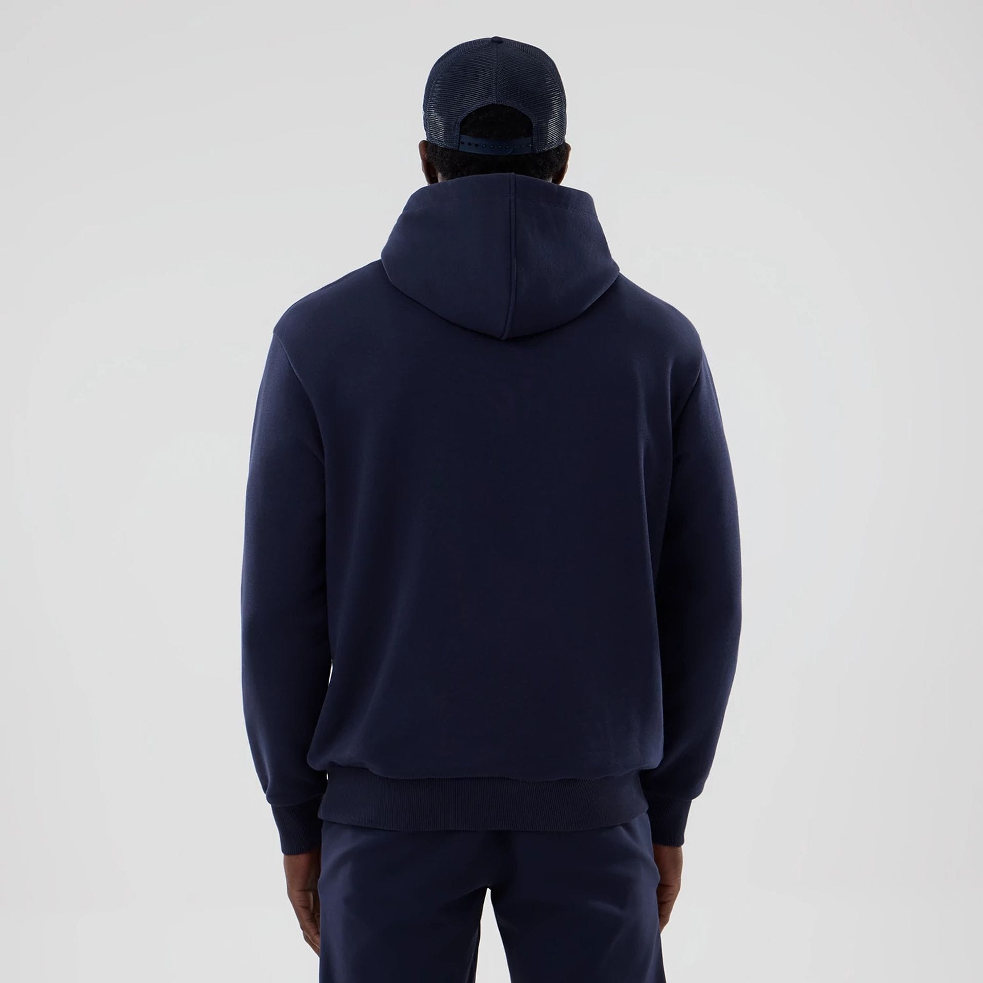 The model is wearing this Atlassian Williams F1 Team Oversized Pullover Hoodie in navy. 2