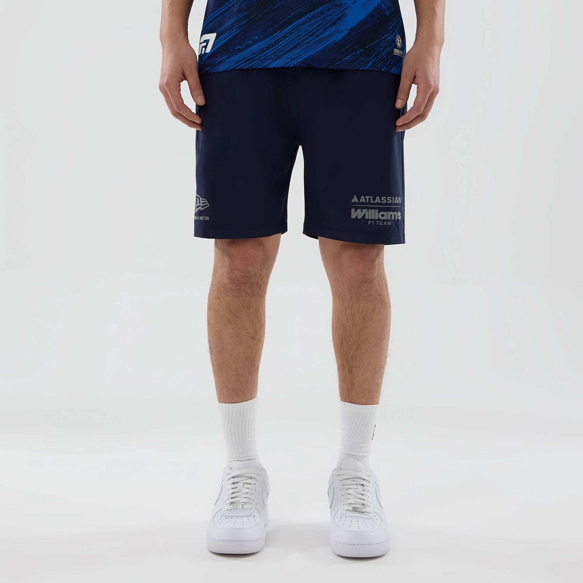 The model is wearing these Atlassian Williams F1 Team Training Shorts in navy. 1
