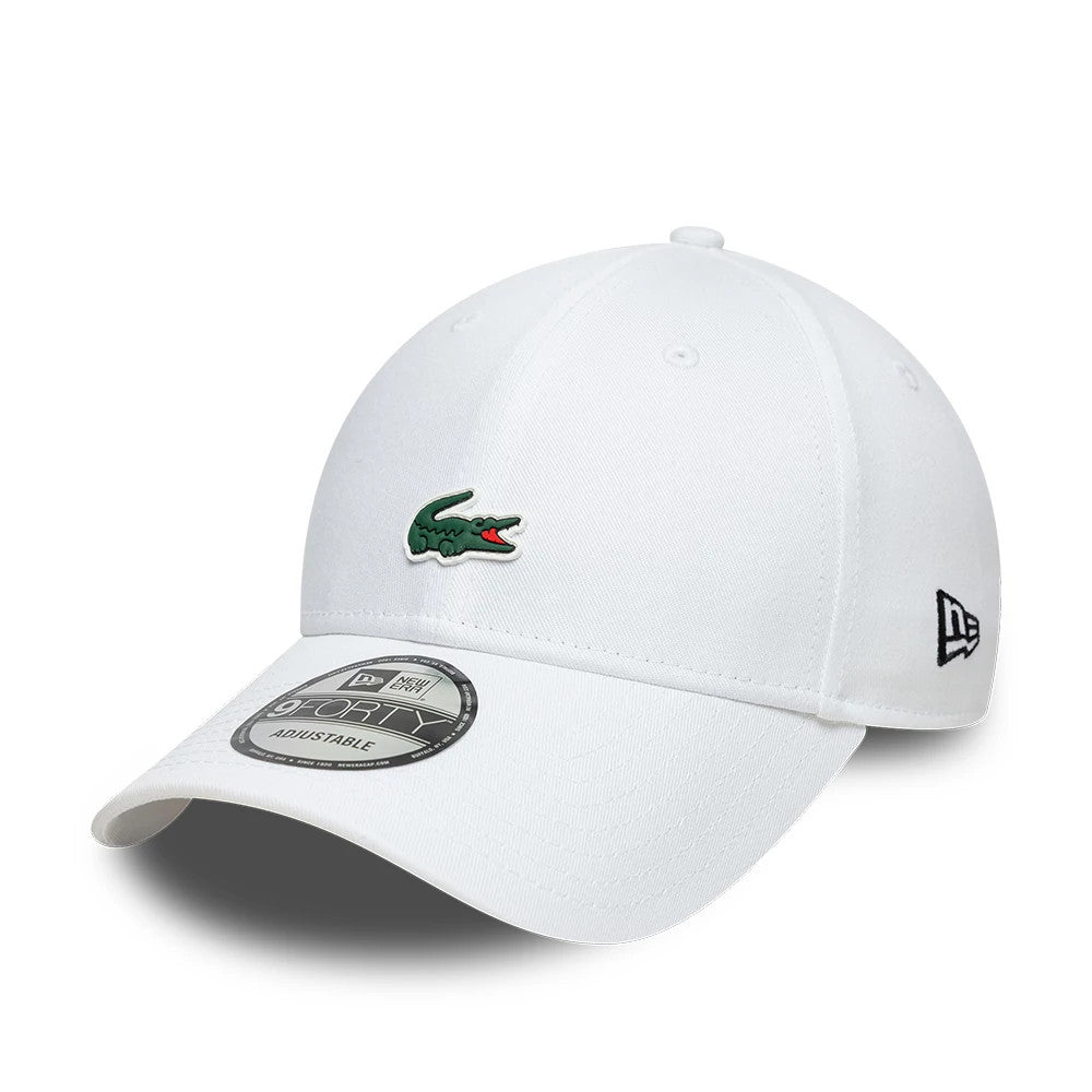 Lacoste X New Era White 9FORTY Adjustable Cap, three-quarter view showing the embroidered green Lacoste crocodile logo on the front panel, white curved visor with a 9FORTY size sticker, and New Era flag logo on the left side.