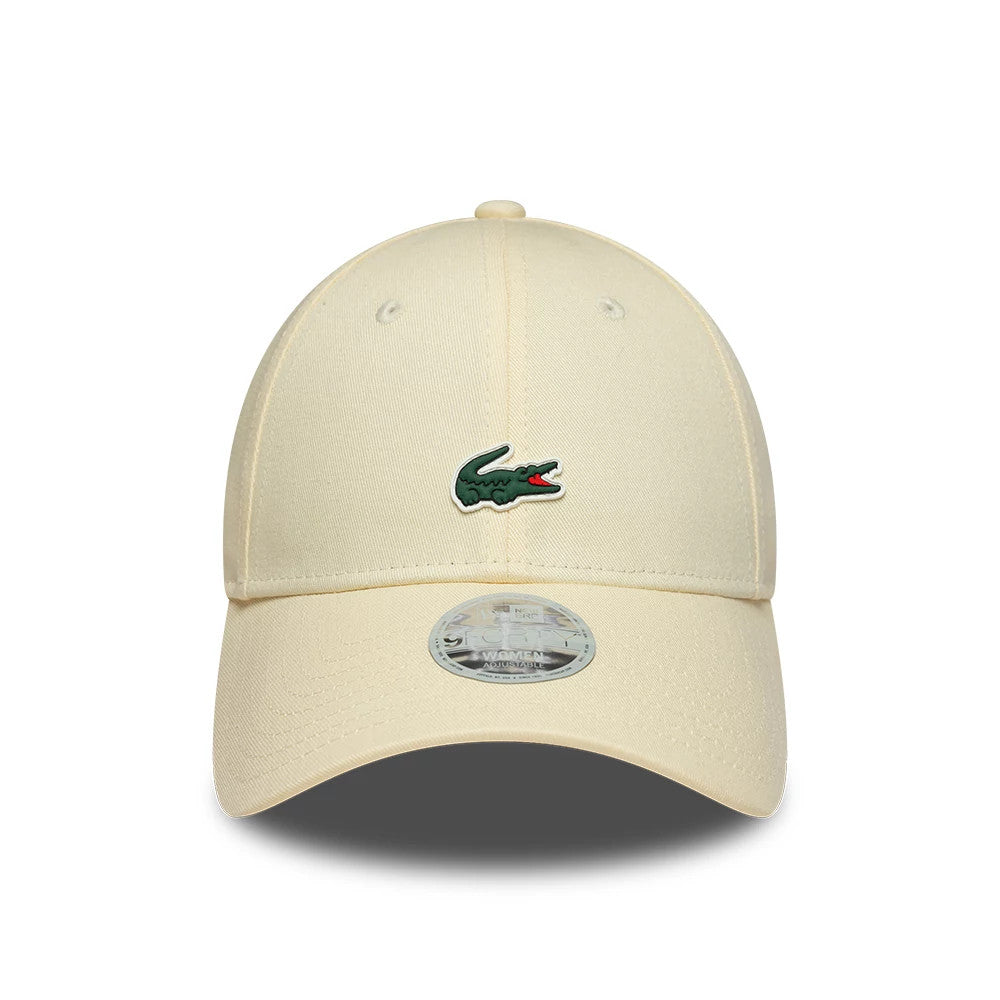 Womens Lacoste X New Era Light Beige 9FORTY Adjustable Cap, front view showing the green embroidered Lacoste crocodile logo on the structured beige crown, curved beige visor, and the 9FORTY size sticker on the centre of the visor.