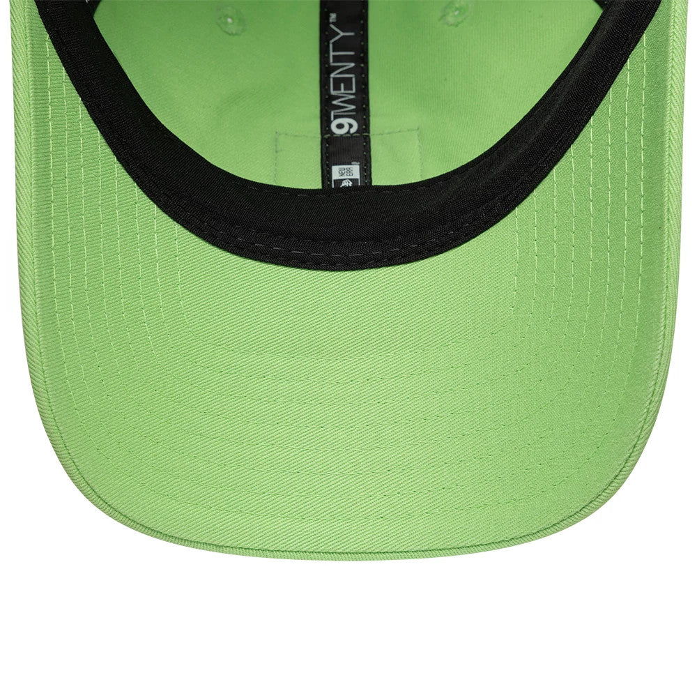 Lacoste X New Era Pastel Green 9TWENTY Adjustable Cap, inside view showing a black sweatband, pastel green undervisor, and black 9TWENTY taping along the inner lining, highlighting the structured interior design of the adjustable cap.