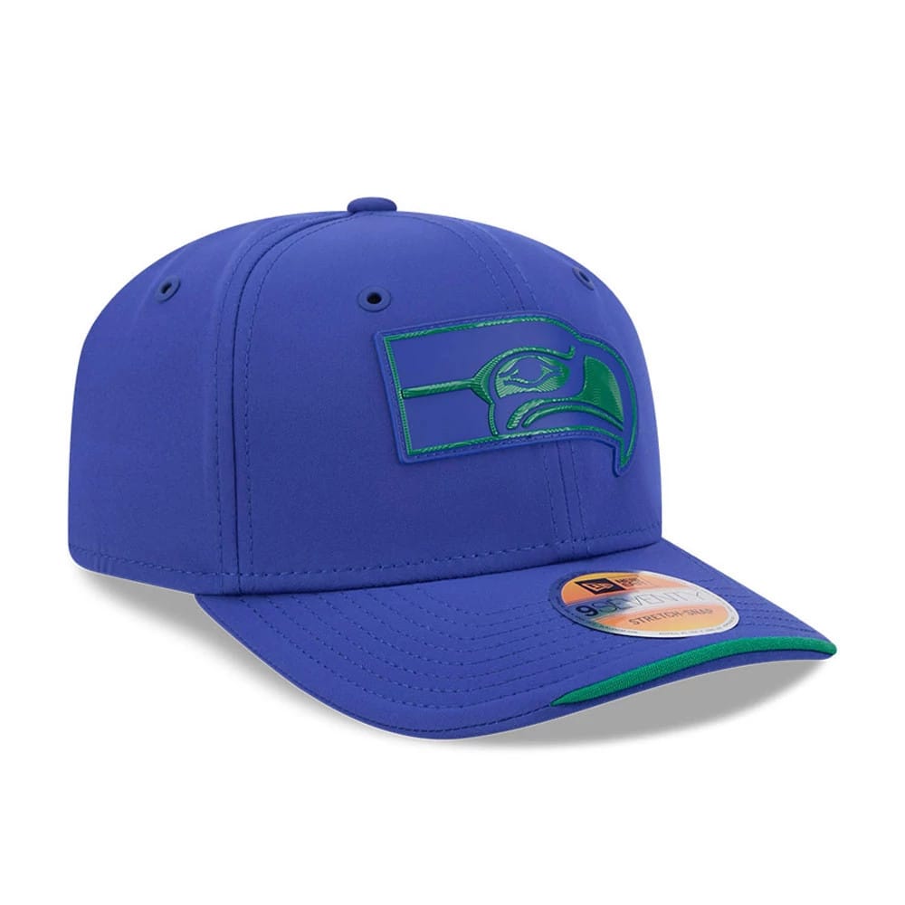 Seahawks NFL Sideline 2026 Blue New Era 9SEVENTY Stretch Snap Adjustable Cap, three-quarter view showing the raised navy and green embroidered Seahawks logo on the front panel, the matching blue visor with green underneath.