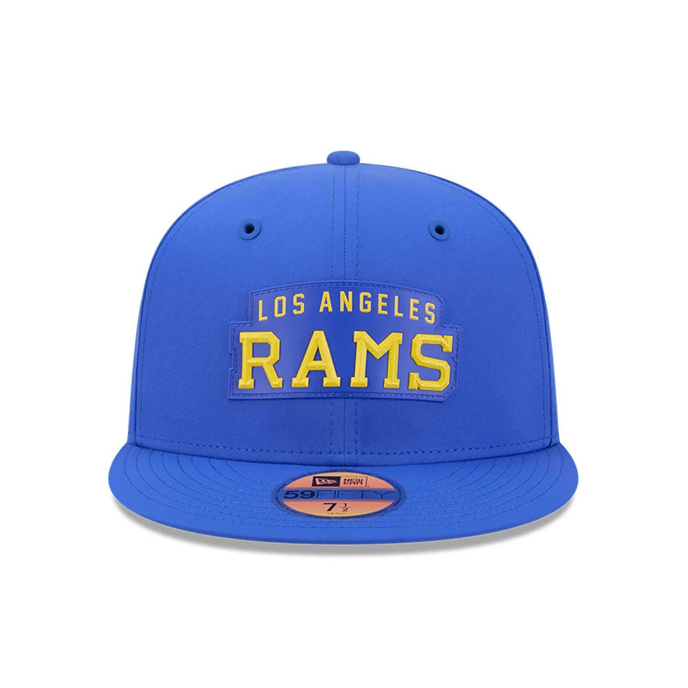 LA Rams NFL Sideline 2026 Blue New Era 59FIFTY Fitted Cap, front view showing raised yellow and white embroidered Los Angeles Rams lettering on the structured blue crown, with a flat blue visor featuring a gold 59FIFTY size sticker.