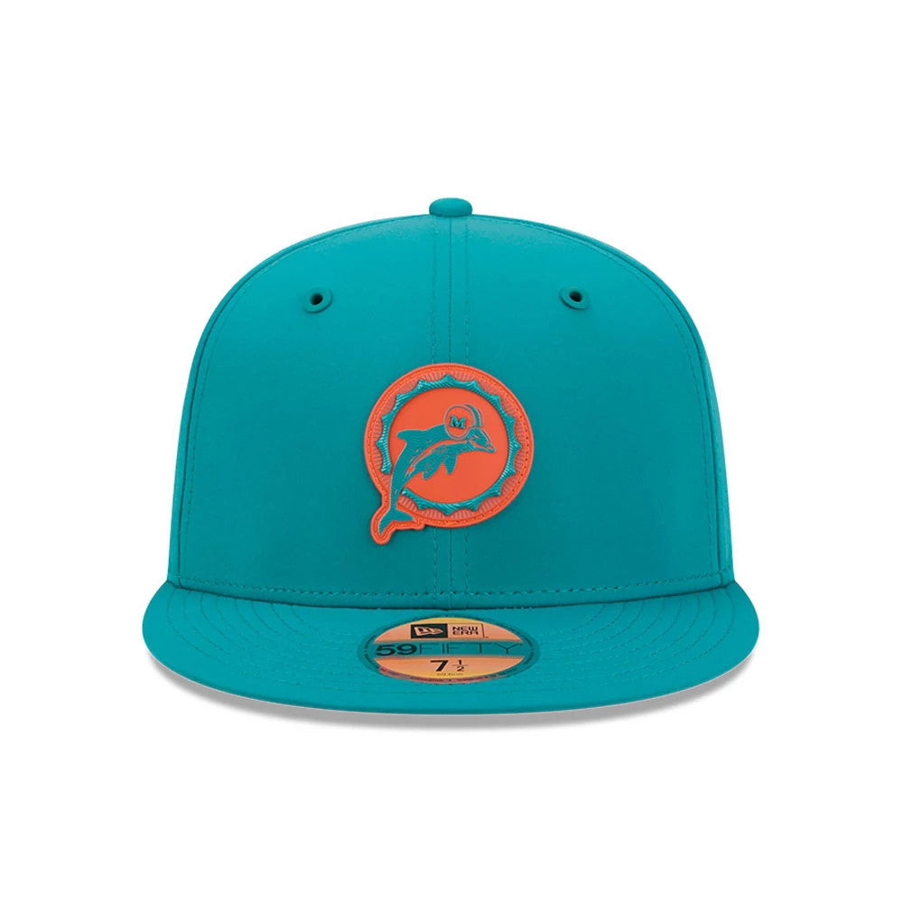 Miami Dolphins NFL Sideline 2026 Turquoise New Era 59FIFTY Fitted Cap, front view showing a raised embroidered orange and turquoise Dolphins logo on the front panels, with a turquoise visor and a gold 59FIFTY size sticker on the visor.