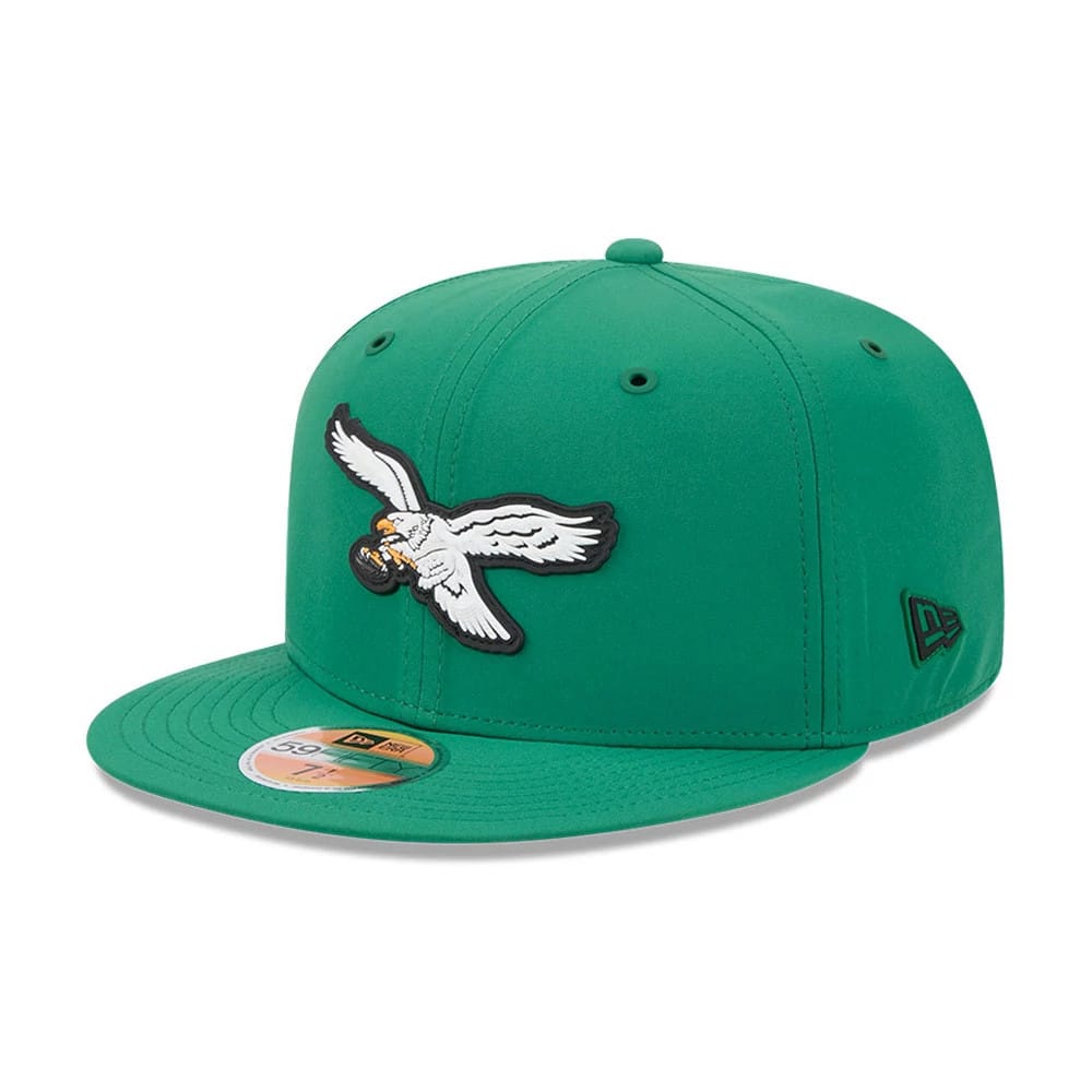 Philadelphia Eagles NFL Sideline 2026 Green New Era 59FIFTY Fitted Cap, three-quarter view showing the white and grey eagle logo in raised embroidery on the green front panels, matching flat visor with a gold 59FIFTY size sticker.