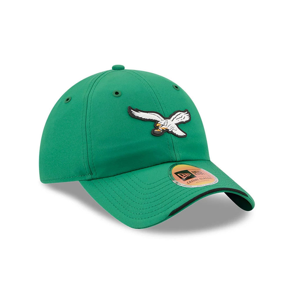 New Era Philadelphia Eagles NFL Sideline 2026 Green Casual Classic Adjustable Cap, three-quarter view showing the white and black embroidered eagle logo on the front panel, green curved visor with a size sticker.