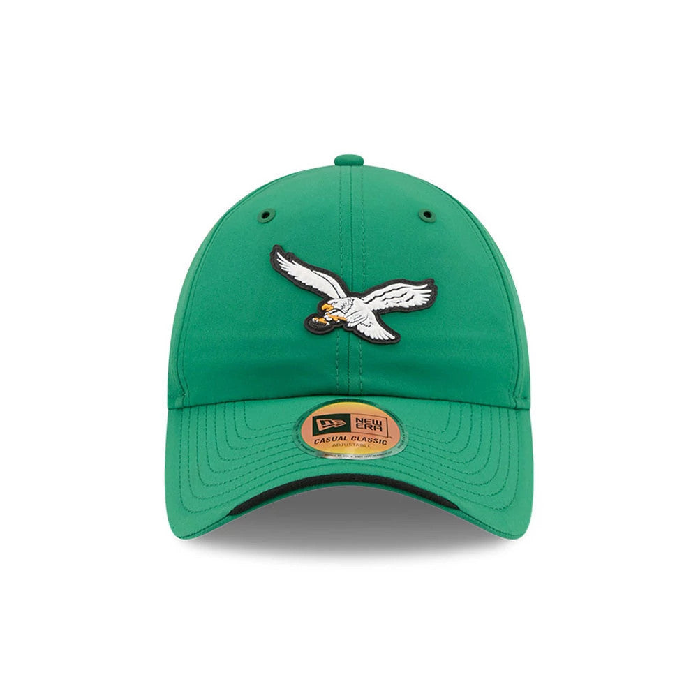 New Era Philadelphia Eagles NFL Sideline 2026 Green Casual Classic Adjustable Cap, front view showing the white and black embroidered eagle logo holding a football on the green structured crown, with matching green curved visor.