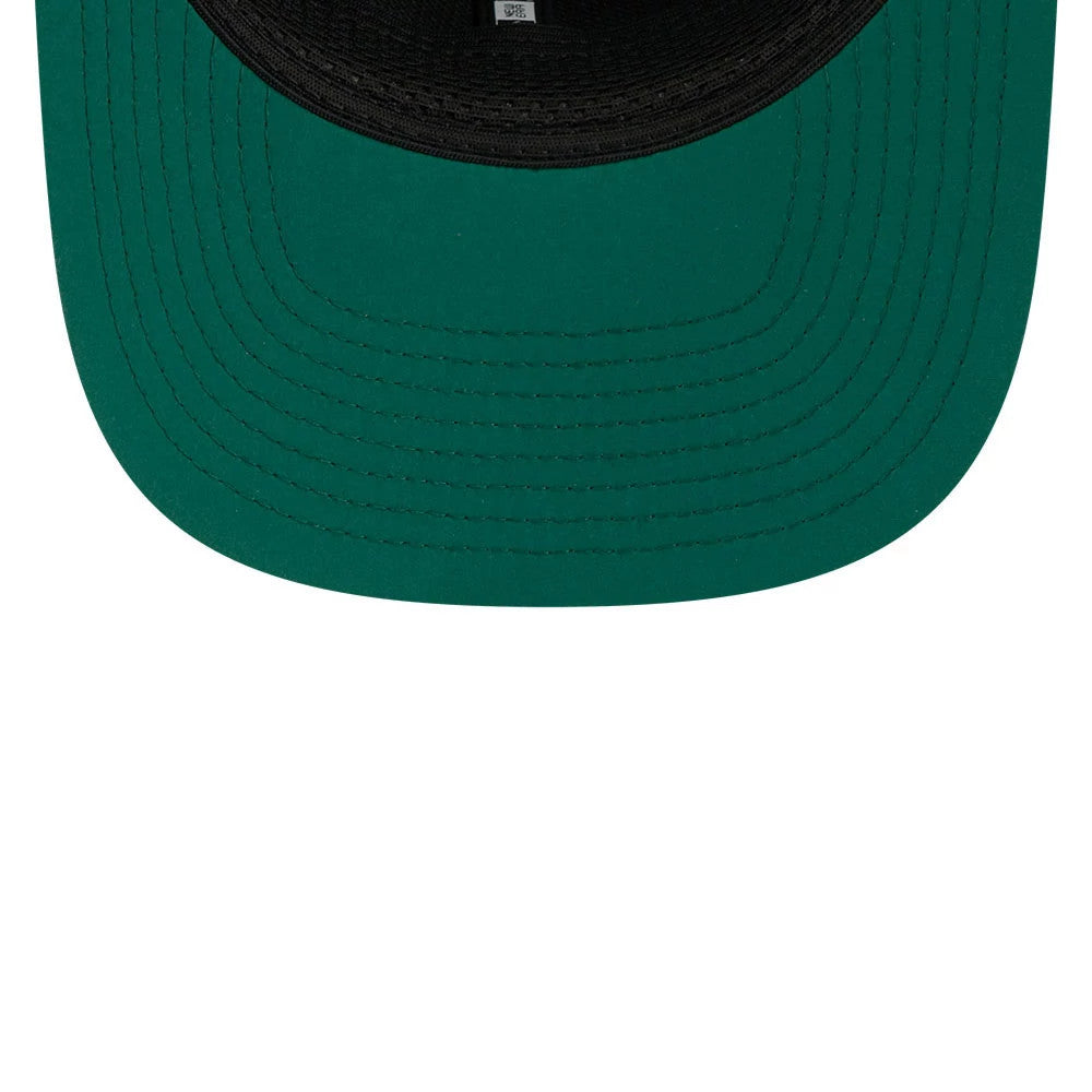 Jets NFL Sideline 2026 Green New Era 9SEVENTY Stretch Snap Adjustable Cap, inside view showing the black sweatband surrounding the green undervisor, with taping lines running across the cap interior.