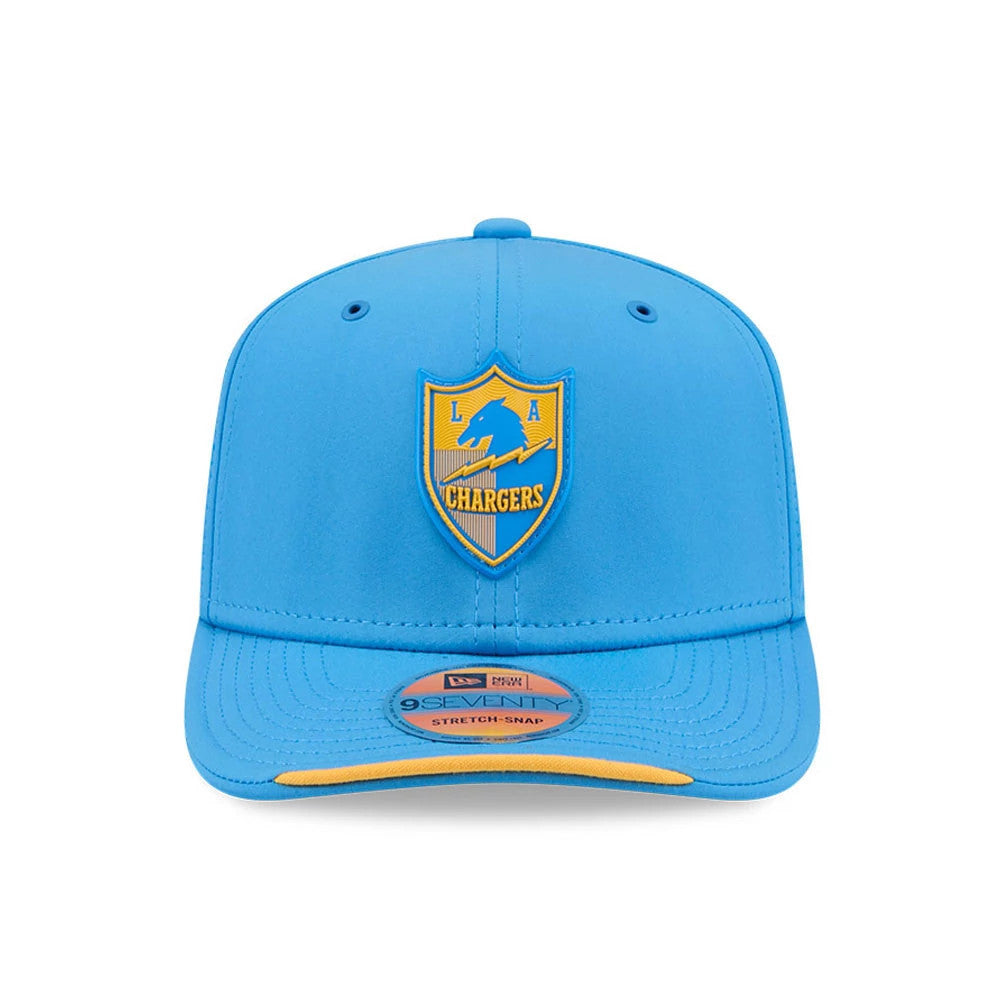 LA Chargers NFL Sideline 2026 Blue New Era 9SEVENTY Stretch Snap Adjustable Cap, front view showing the raised yellow and blue LA Chargers logo on the front panel, blue curved visor with a yellow undervisor, and a 9SEVENTY size sticker.