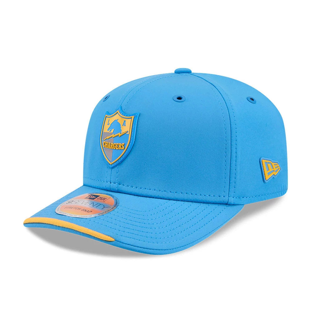 LA Chargers NFL Sideline 2026 Blue New Era 9SEVENTY Stretch Snap Adjustable Cap, three-quarter view showing the raised LA Chargers logo in blue and yellow on the front panel, with a matching blue visor featuring a yellow edge.