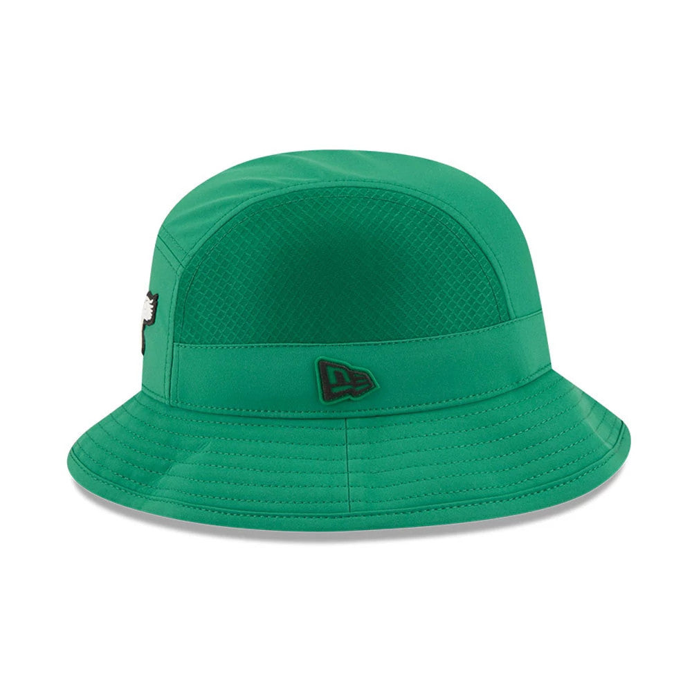New Era Philadelphia Eagles NFL Sideline 2026 Green Stretch Bucket Cap, side view showing the New Era flag logo embroidered on the green band, a textured pattern on the upper half of the crown, and detailed stitching on the wide visor.