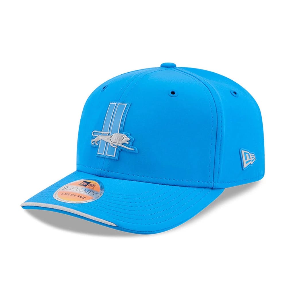 Detroit Lions NFL Sideline 2026 Blue New Era 9SEVENTY Stretch Snap Adjustable Cap, three-quarter view showing the raised embroidered team logo on the front panel, matching blue visor with a 9SEVENTY size sticker.